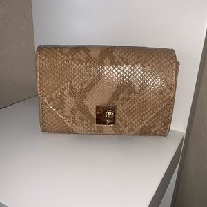 Miss Lola nude snake print bag.